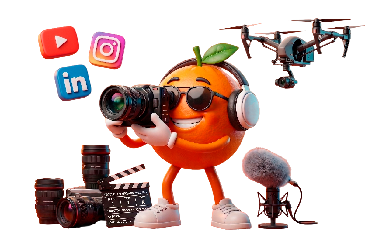 Mascote da Bergamota com câmera fotográfica cercado por equipamentos de captação audiovisual